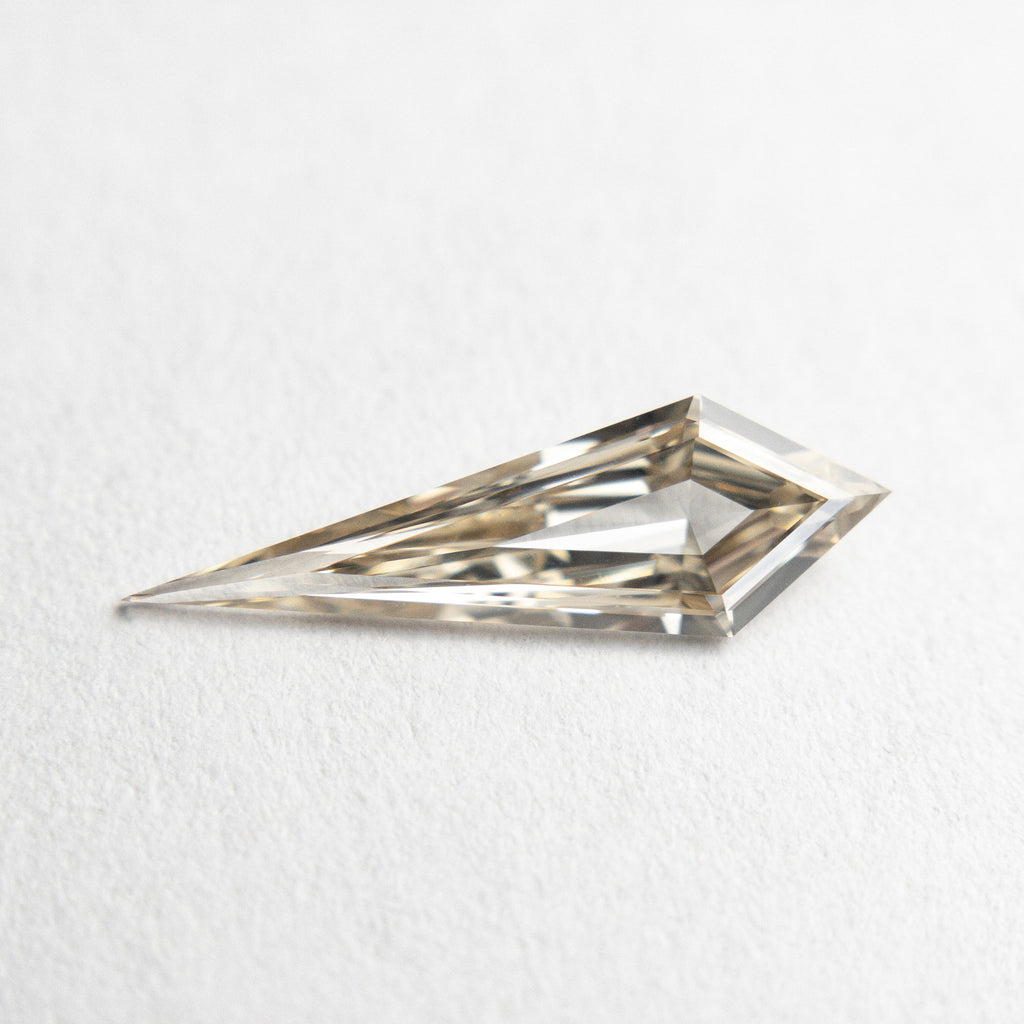 0.58ct 13.83x4.36x1.91mm VS+ Champagne Kite Step Cut 18518-01 - Misfit Diamonds
